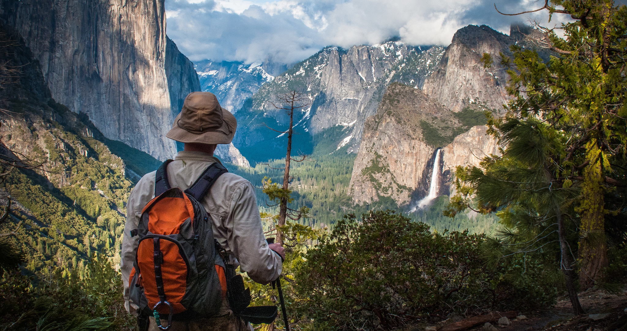 Hiker viewing Bridalveil Falls in Yosemite